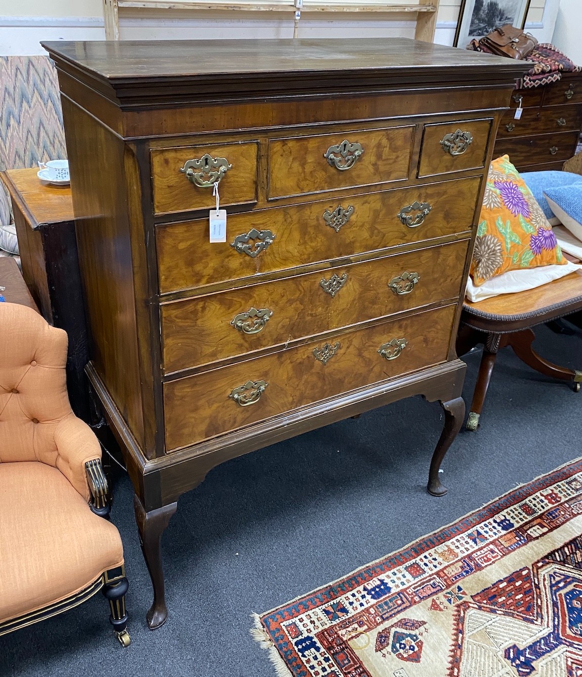 A George III flamed mahogany chest on later stand, width 109cm, depth 53cm, height 145cm